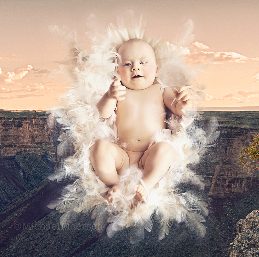 a custom cutout of a baby resting on a blanket by michael maersch